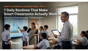 An Indian school principal smiling while holding a tablet, observing a teacher and students actively engaging with an interactive smart board. Text overlay: 7 Daily Routines That Make Smart Classrooms Actually Work.